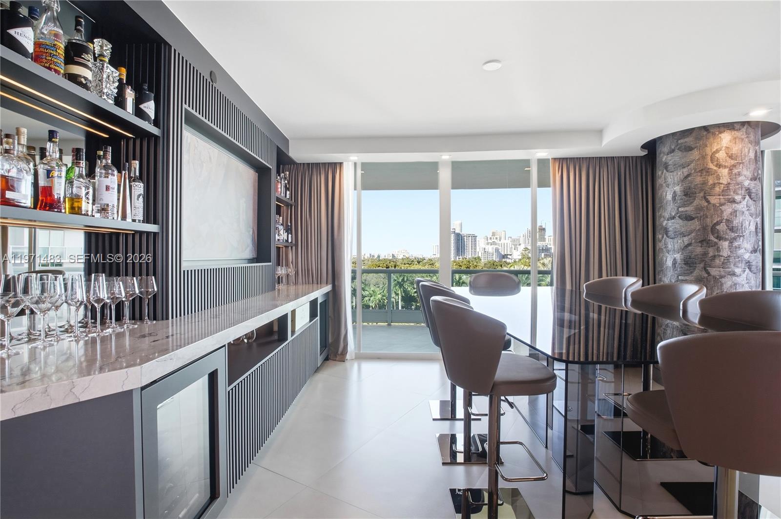 2127 Brickell Avenue, Unit 904 Miami, FL 33129 - Photo 12 of 38 a living room with furniture and a large window