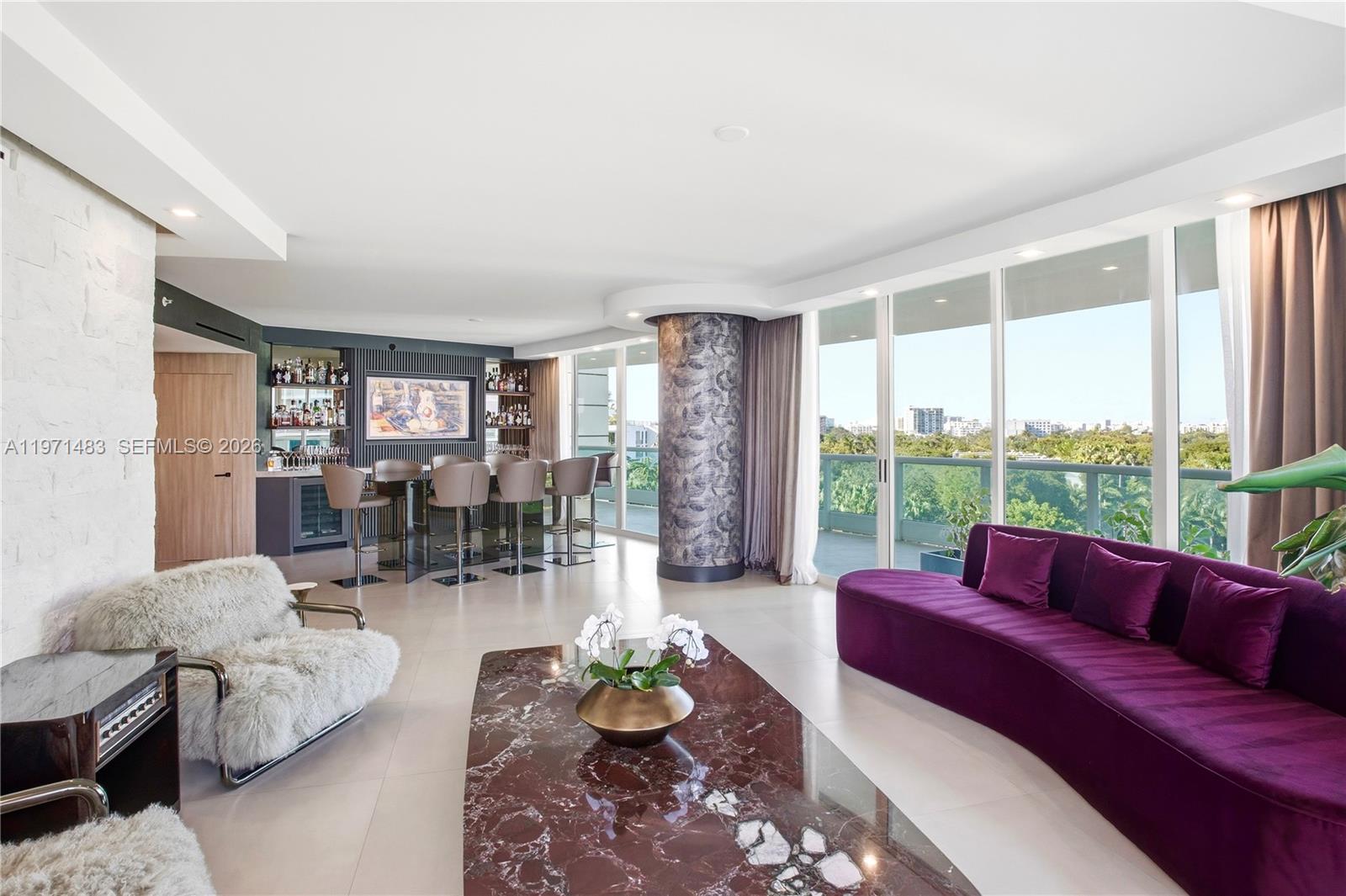 2127 Brickell Avenue, Unit 904 Miami, FL 33129 - Photo 13 of 38 a living room with furniture and a large window