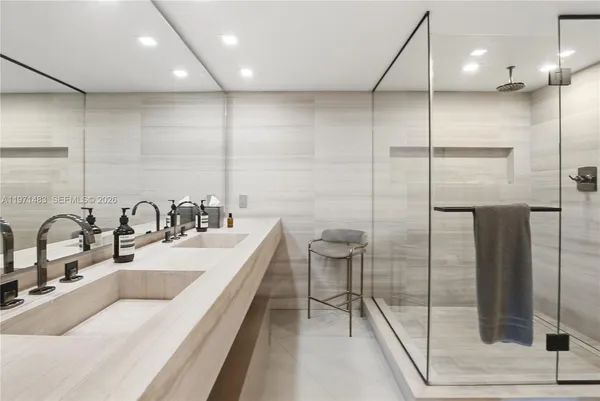 a bathroom with a sink double vanity and a mirror