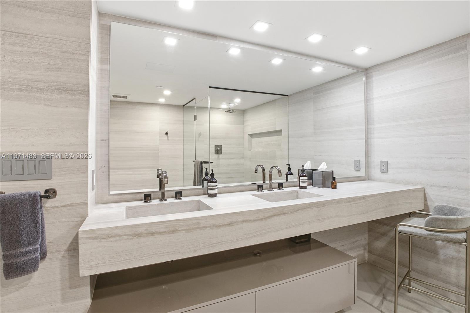 2127 Brickell Avenue, Unit 904 Miami, FL 33129 - Photo 26 of 38 a bathroom with a sink double vanity and a mirror