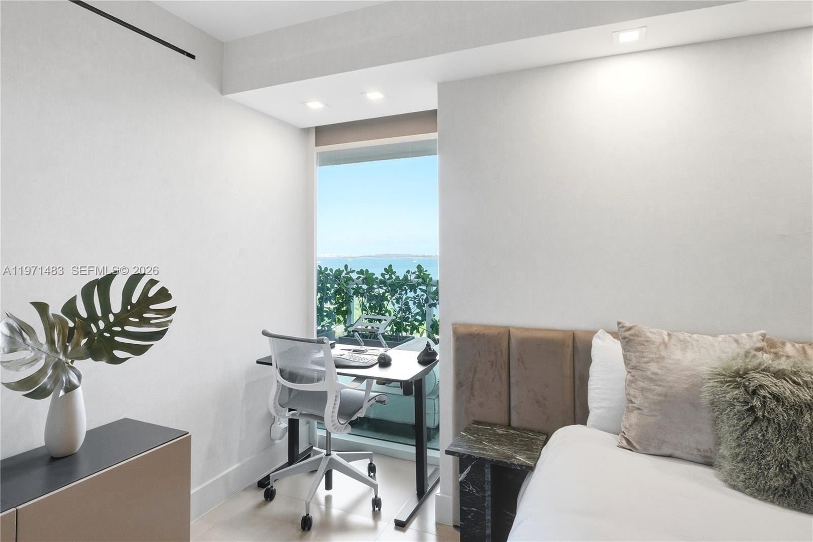 2127 Brickell Avenue, Unit 904 Miami, FL 33129 - Photo 29 of 38 a living room with furniture and a potted plant