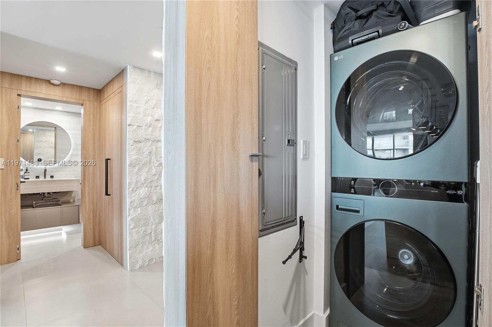 2127 Brickell Avenue, Unit 904 Miami, FL 33129 - Photo 32 of 38 a view of a hallway with washer and dryer