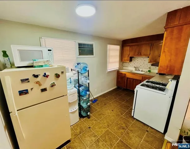 a room with furniture and white walls