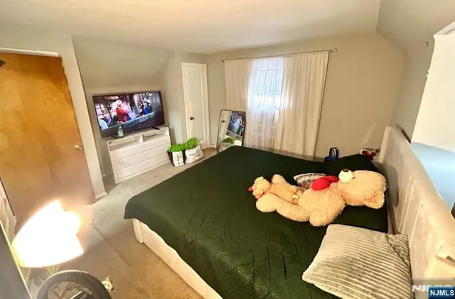 a living room with a couch and a floor to ceiling window