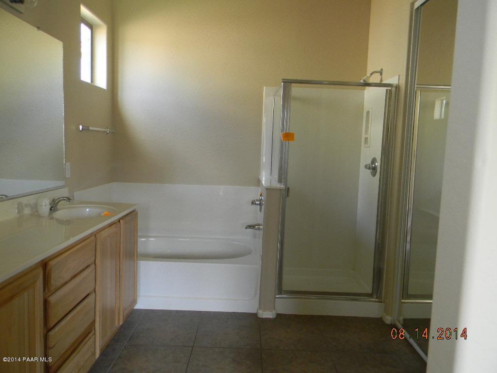 4791 Edgemont Road Prescott Valley, AZ 86314 - Photo 20 of 42 a bathroom with a shower and a sink