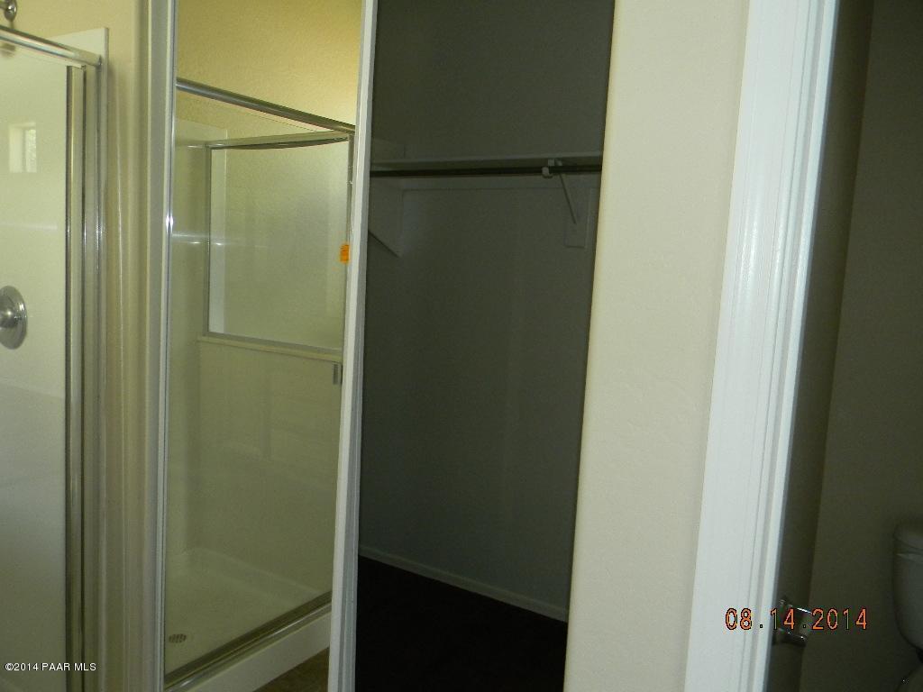 4791 Edgemont Road Prescott Valley, AZ 86314 - Photo 23 of 42 a bathroom with a glass shower door