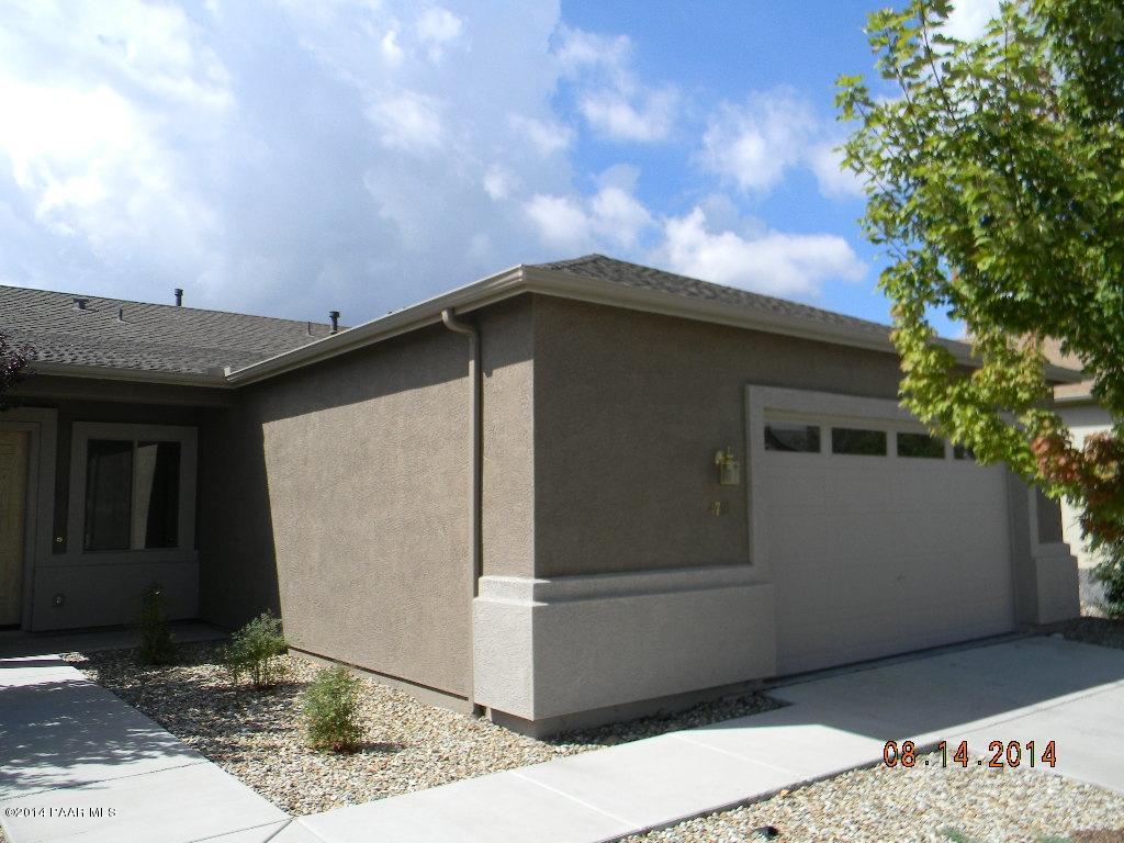 4791 Edgemont Road Prescott Valley, AZ 86314 - Photo 9 of 42 a yellow house with a outdoor space