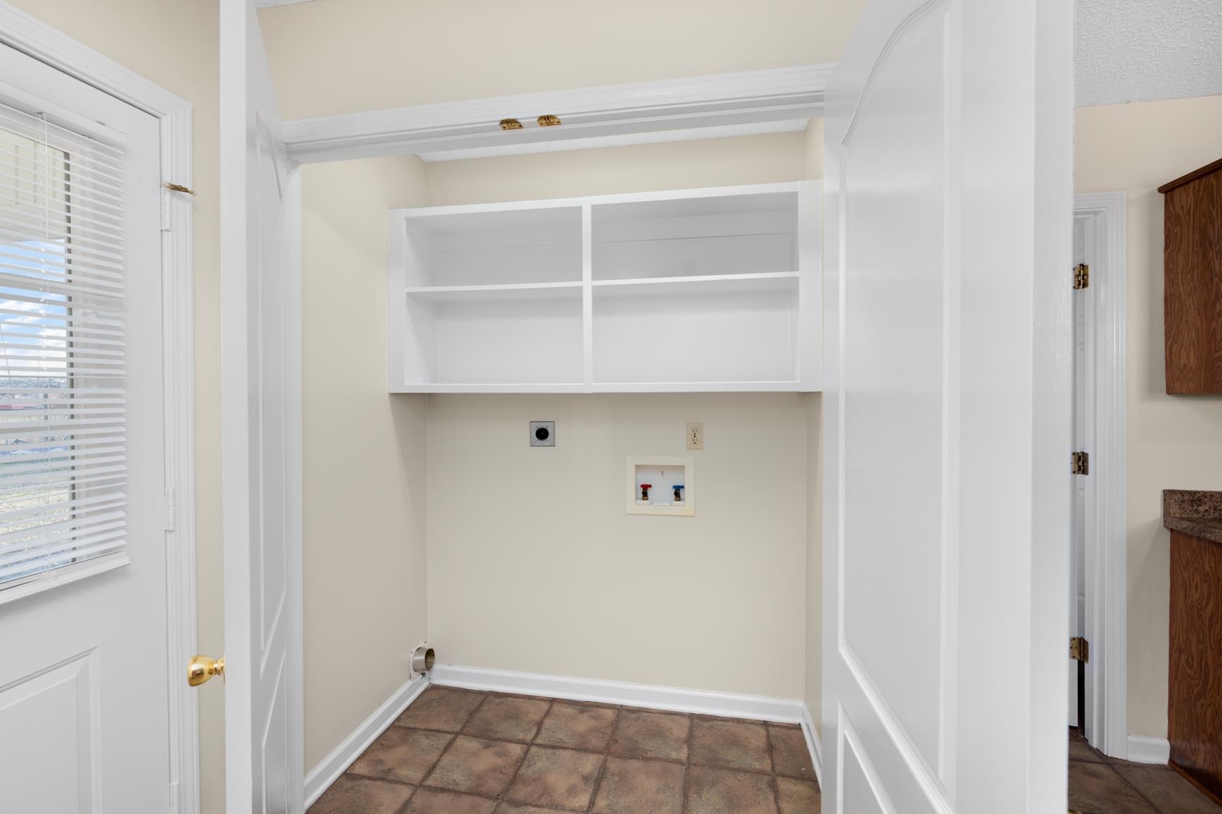 212 Feezor Street Covington, TN 38019 - Photo 12 of 31 a view of a room with rack on the wall