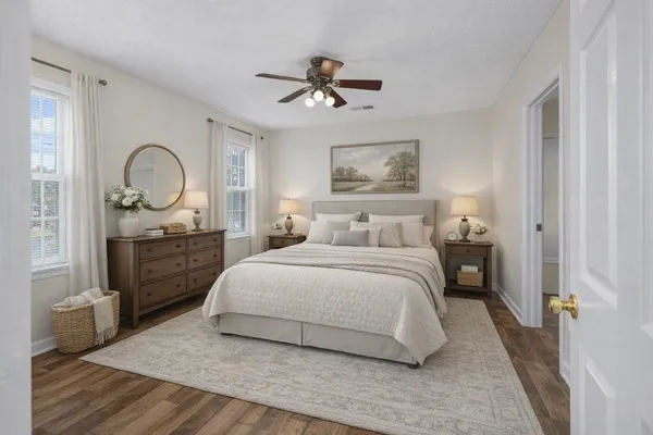 a bedroom with a bed and a dresser