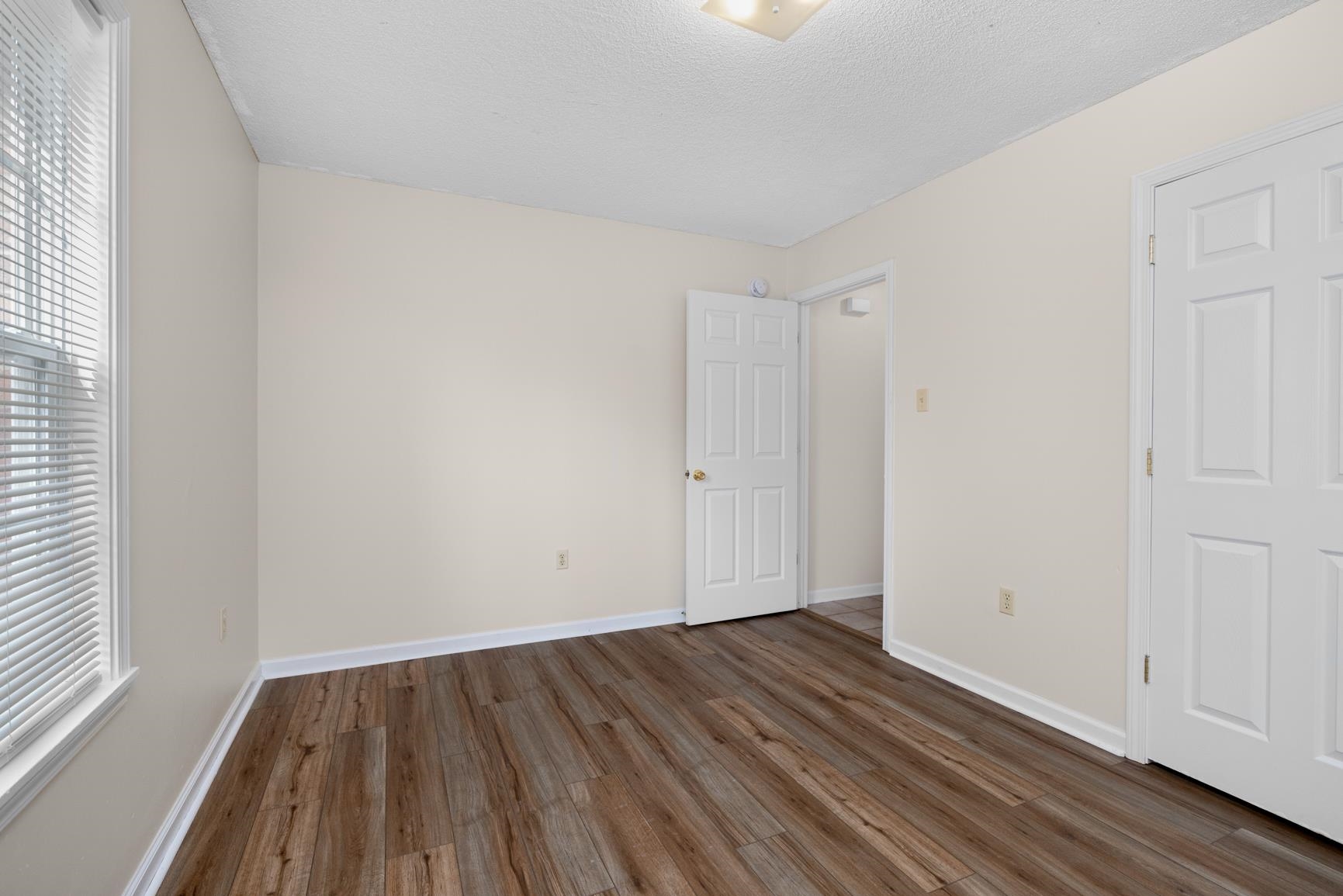 212 Feezor Street Covington, TN 38019 - Photo 23 of 31 a view of an empty room with wooden floor