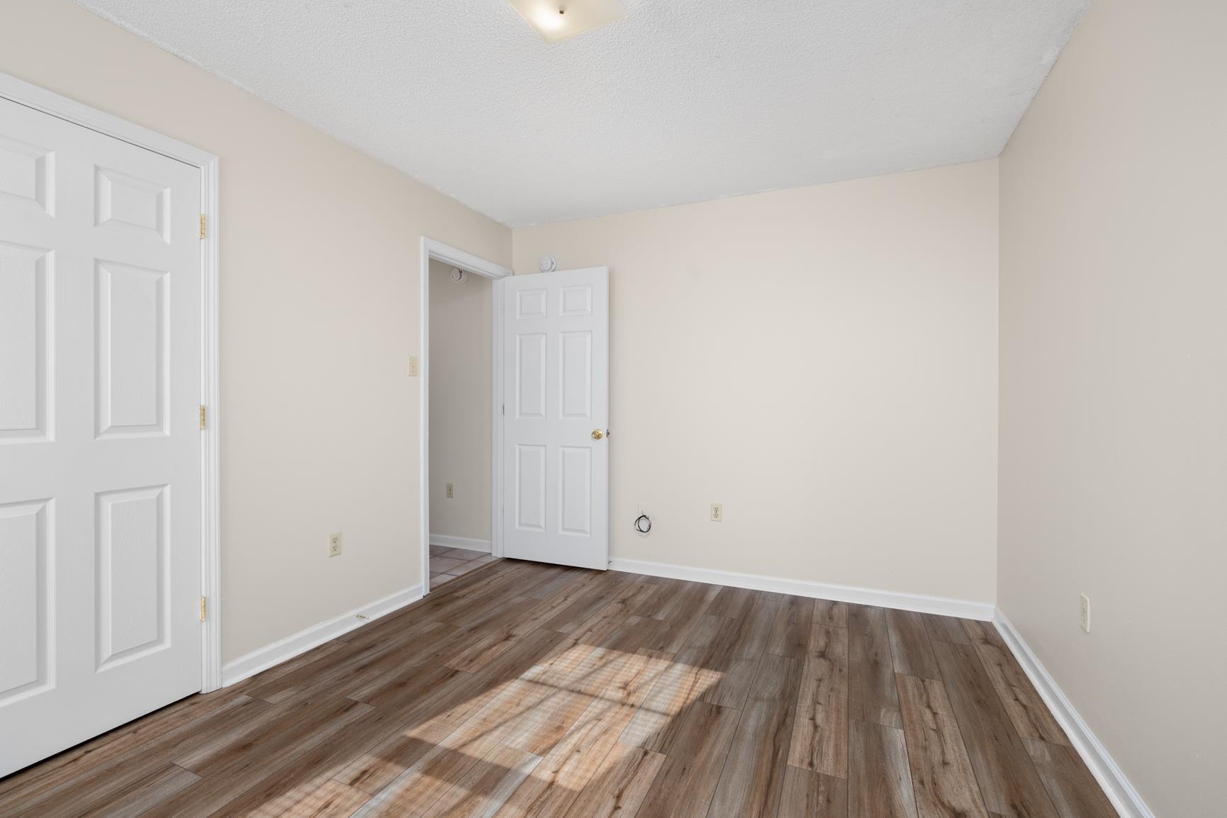 212 Feezor Street Covington, TN 38019 - Photo 24 of 31 an empty room with wooden floor