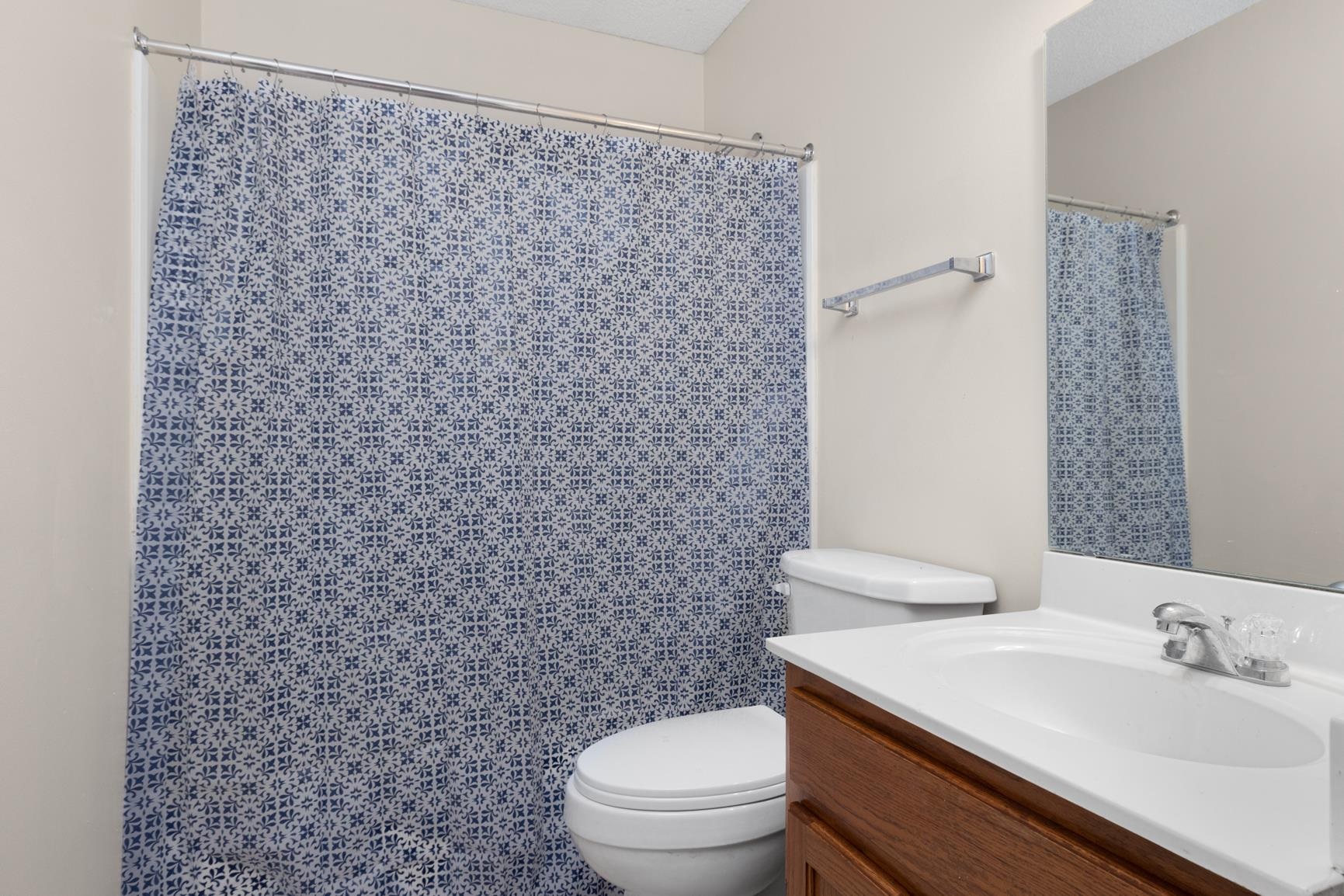 212 Feezor Street Covington, TN 38019 - Photo 29 of 31 a bathroom with a sink a toilet and a mirror