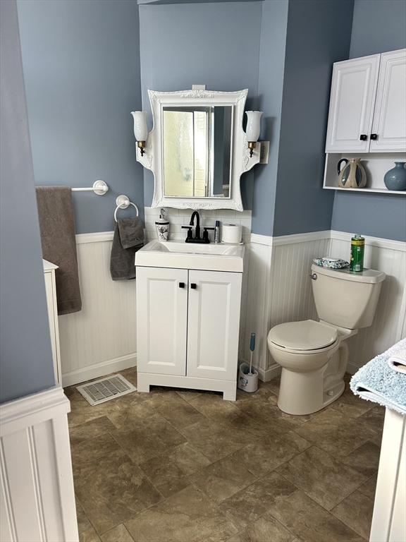 20 Shawmut Avenue New Bedford, MA 02740 - Photo 17 of 29 a bathroom with a toilet sink and mirror