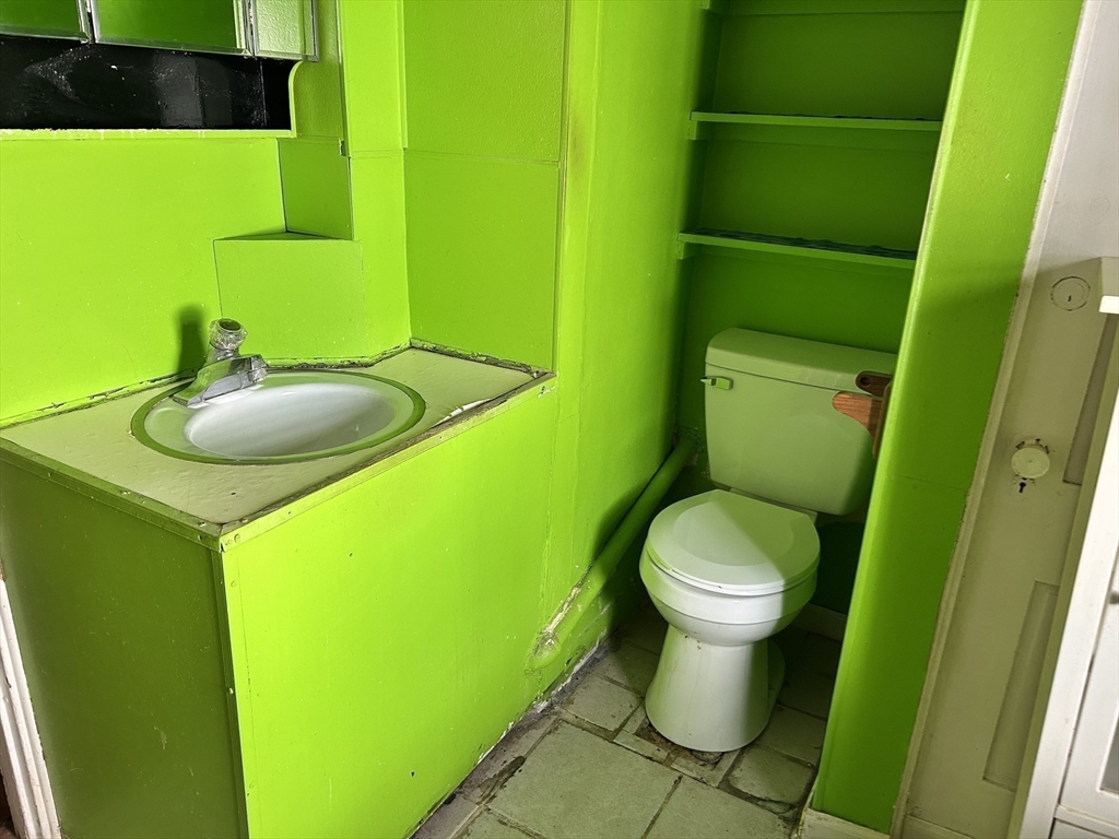 20 Shawmut Avenue New Bedford, MA 02740 - Photo 26 of 29 a bathroom with a toilet and a sink