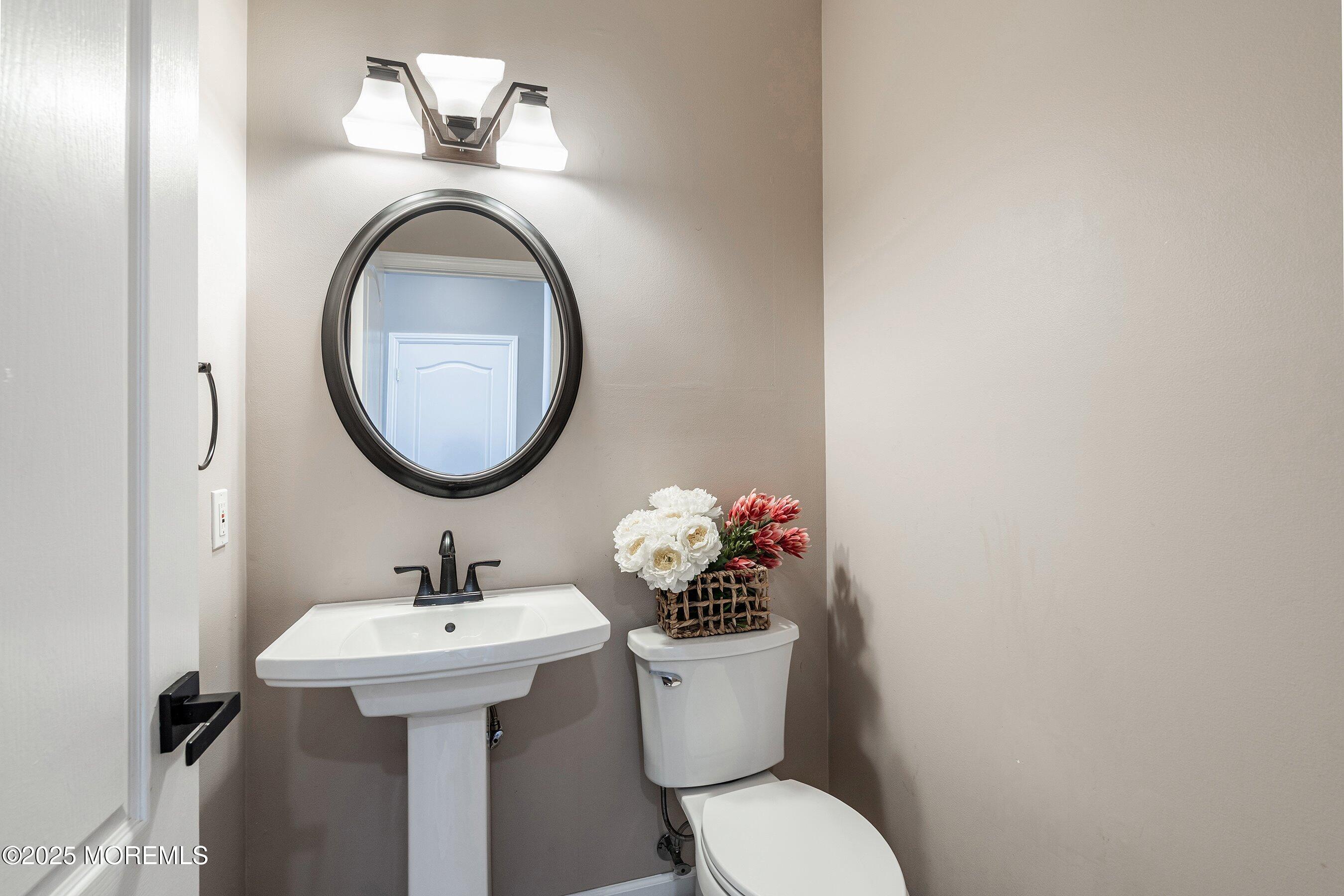 210 Rivers Glen Terrace Toms River, NJ 08755 - Photo 22 of 61 a bathroom with a sink mirror and toilet