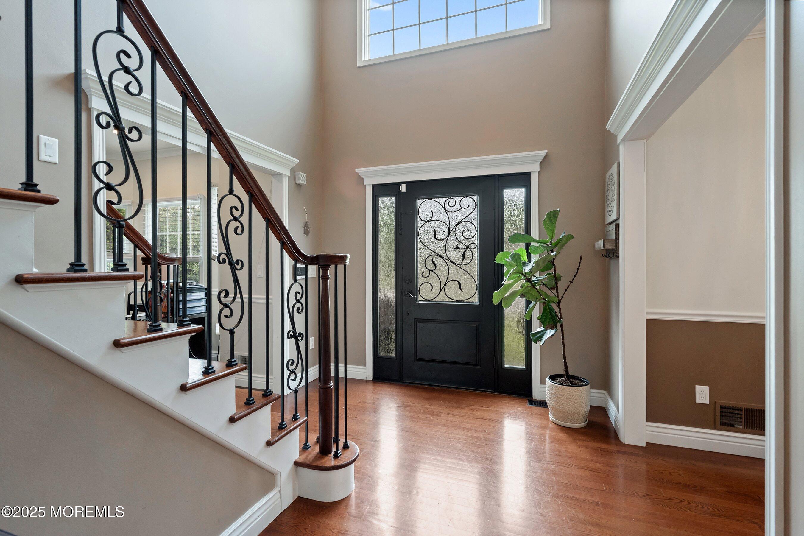 210 Rivers Glen Terrace Toms River, NJ 08755 - Photo 23 of 61 a view of an entryway with wooden floor and windows