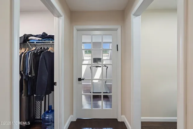 a view of walk in closet with clothes