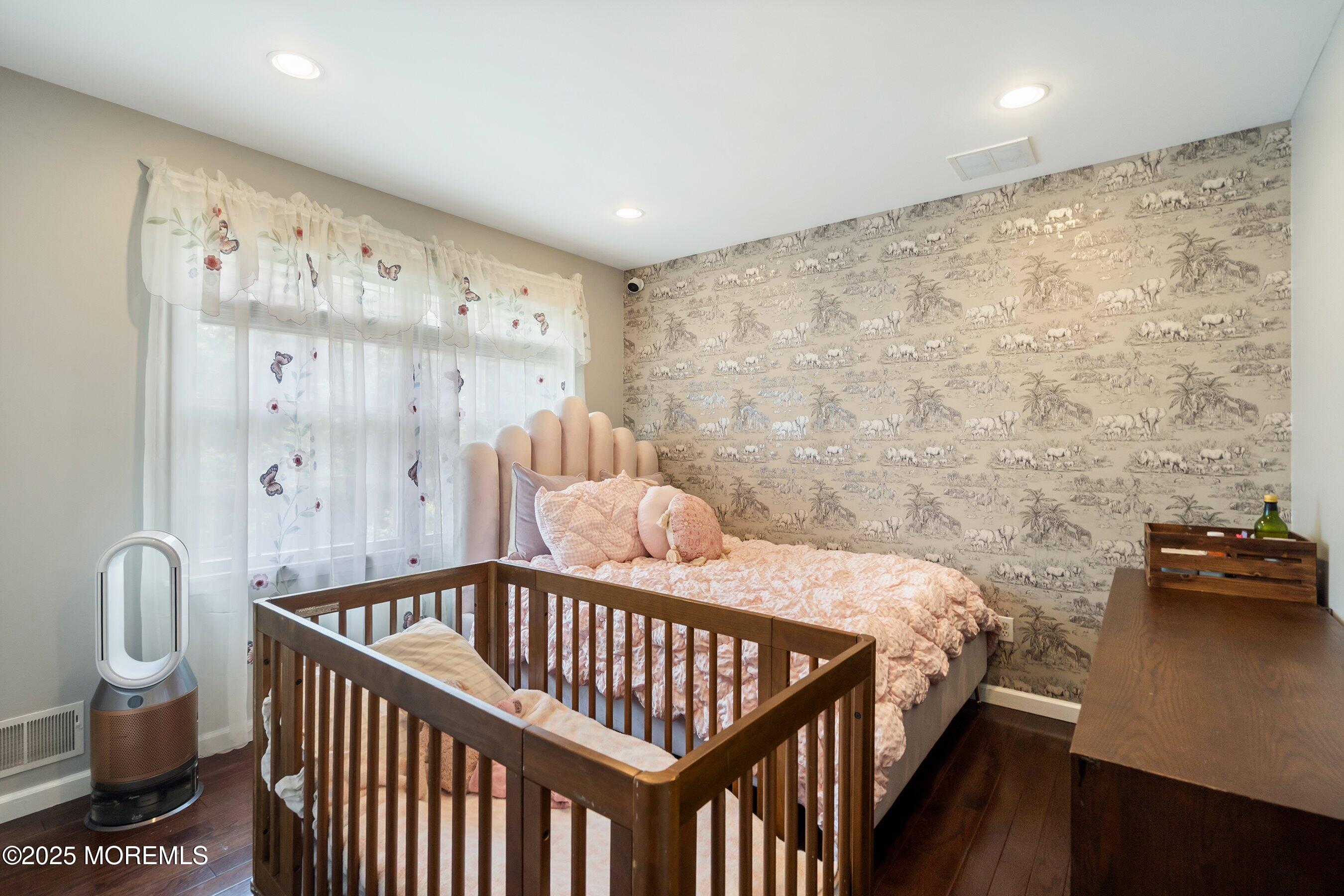 210 Rivers Glen Terrace Toms River, NJ 08755 - Photo 36 of 61 a bedroom with a bed and wooden floor