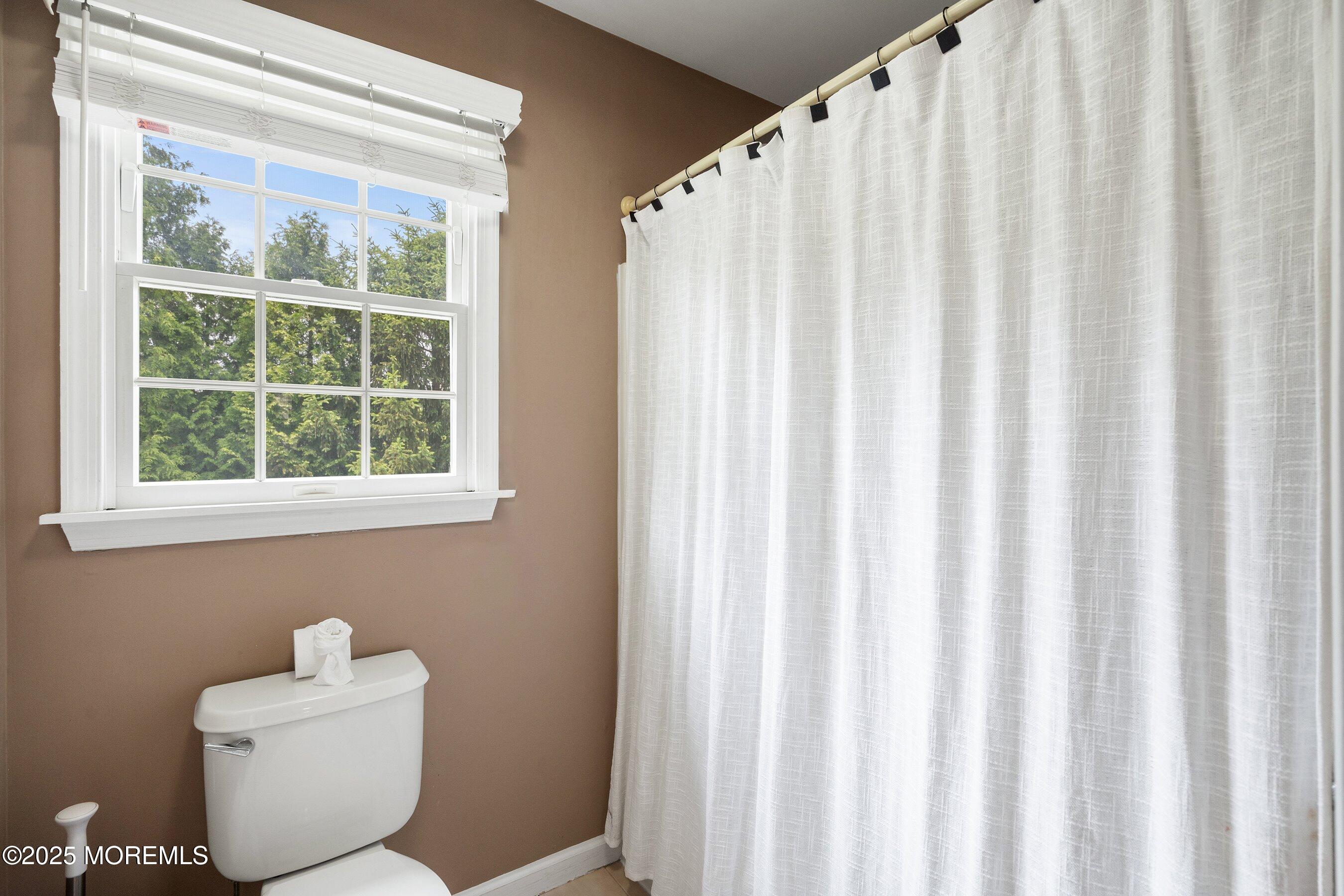 210 Rivers Glen Terrace Toms River, NJ 08755 - Photo 39 of 61 a white toilet sitting next to a window