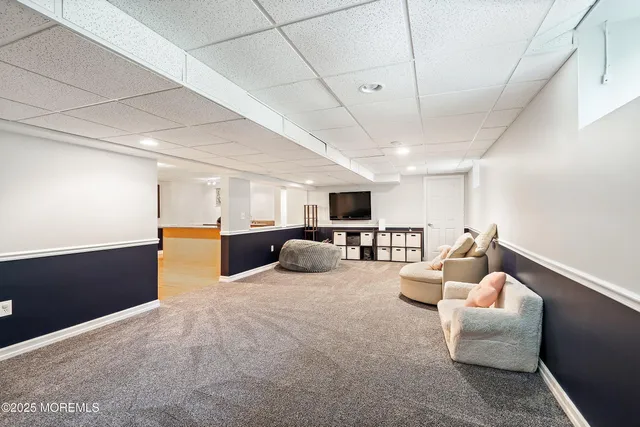 a utility room with lots of clutter and washer