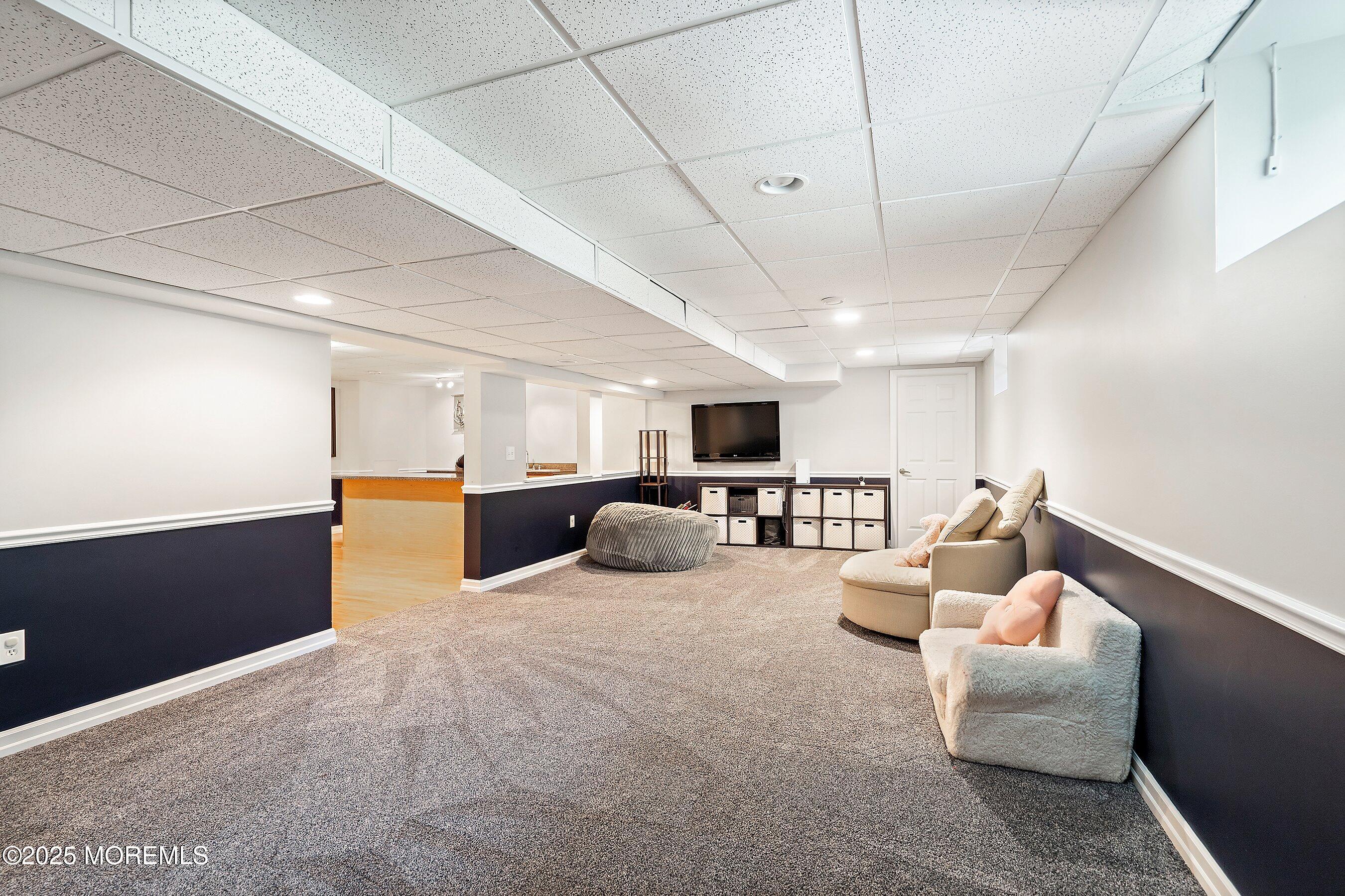 210 Rivers Glen Terrace Toms River, NJ 08755 - Photo 42 of 61 a large room with lots of furniture and a view of kitchen