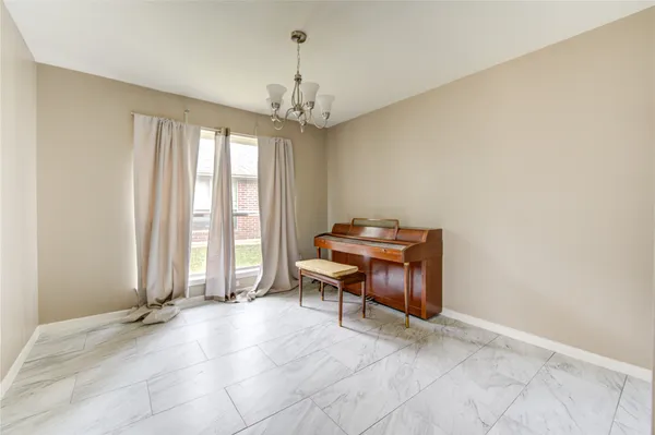 a view of a livingroom with couch and a window
