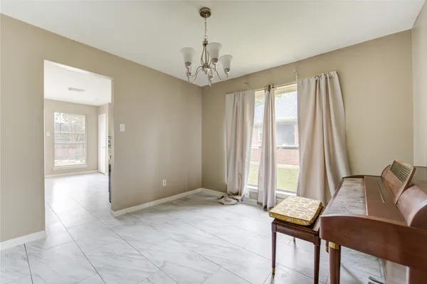 a view of a room with furniture and windows