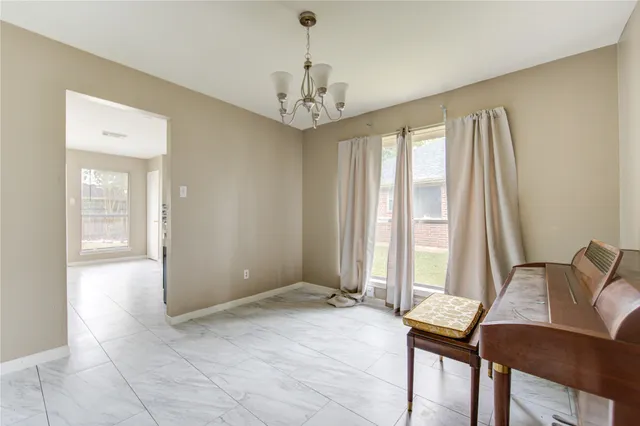 a view of a room with furniture and windows