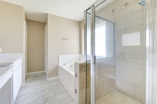 a bathroom with a sink a mirror and a shower