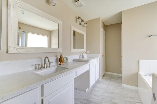 a bathroom with sink and a mirror