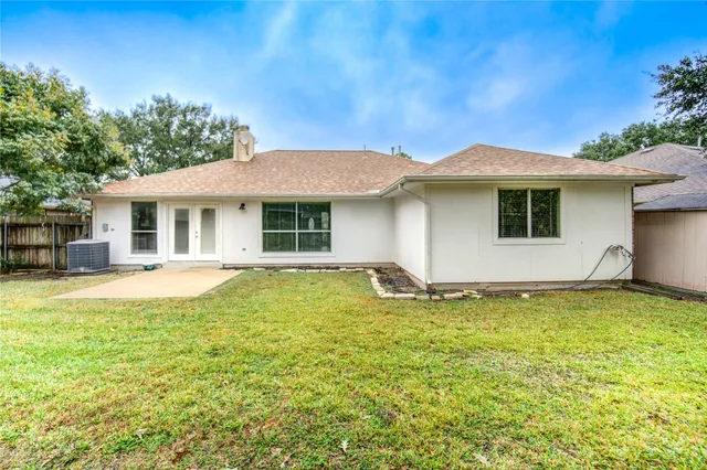 a house view with a backyard space