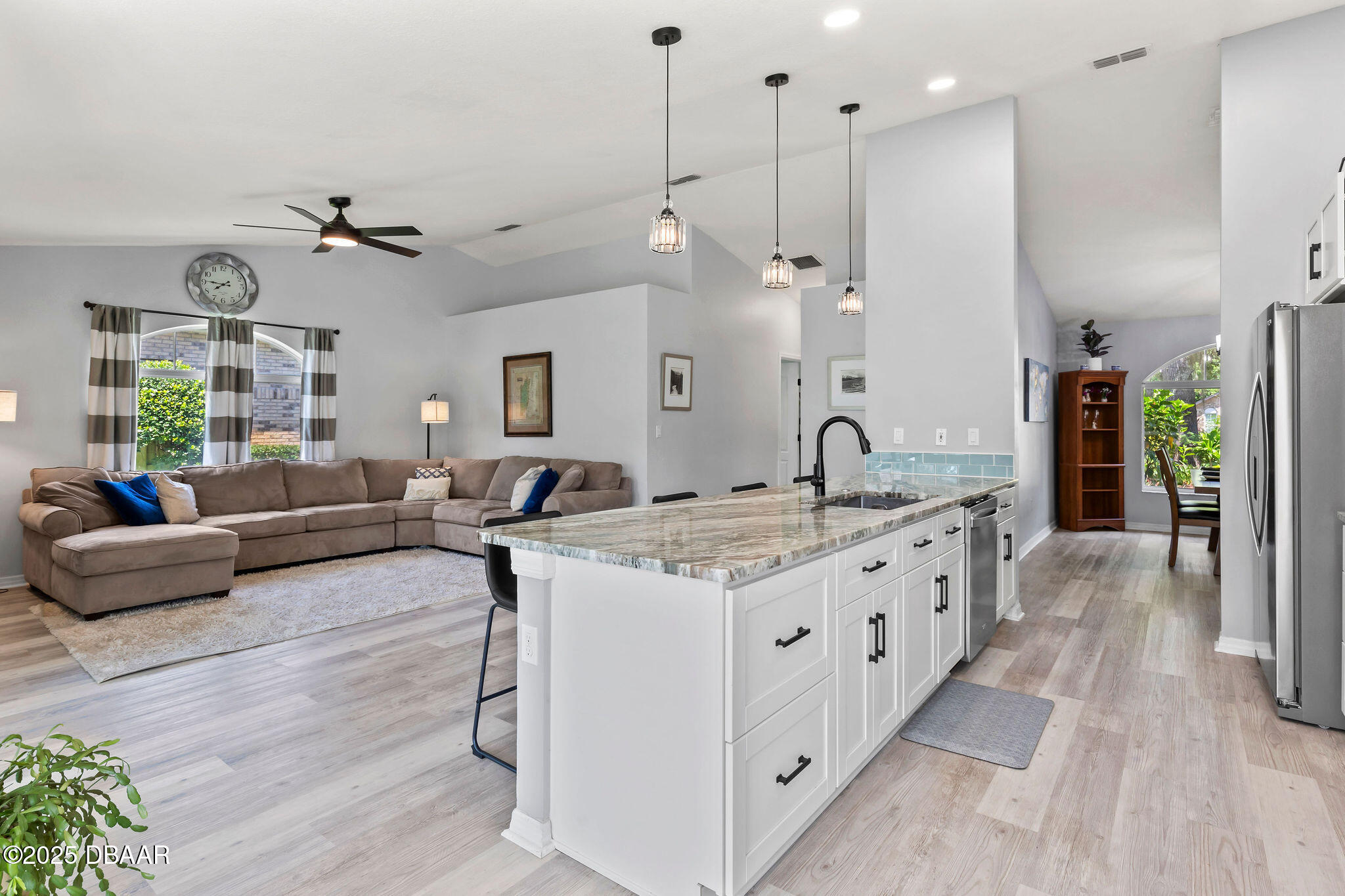 35 China Moon Drive Ormond Beach, FL 32174 - Photo 21 of 40 a large kitchen with kitchen island a large counter space a sink stainless steel appliances and cabinets