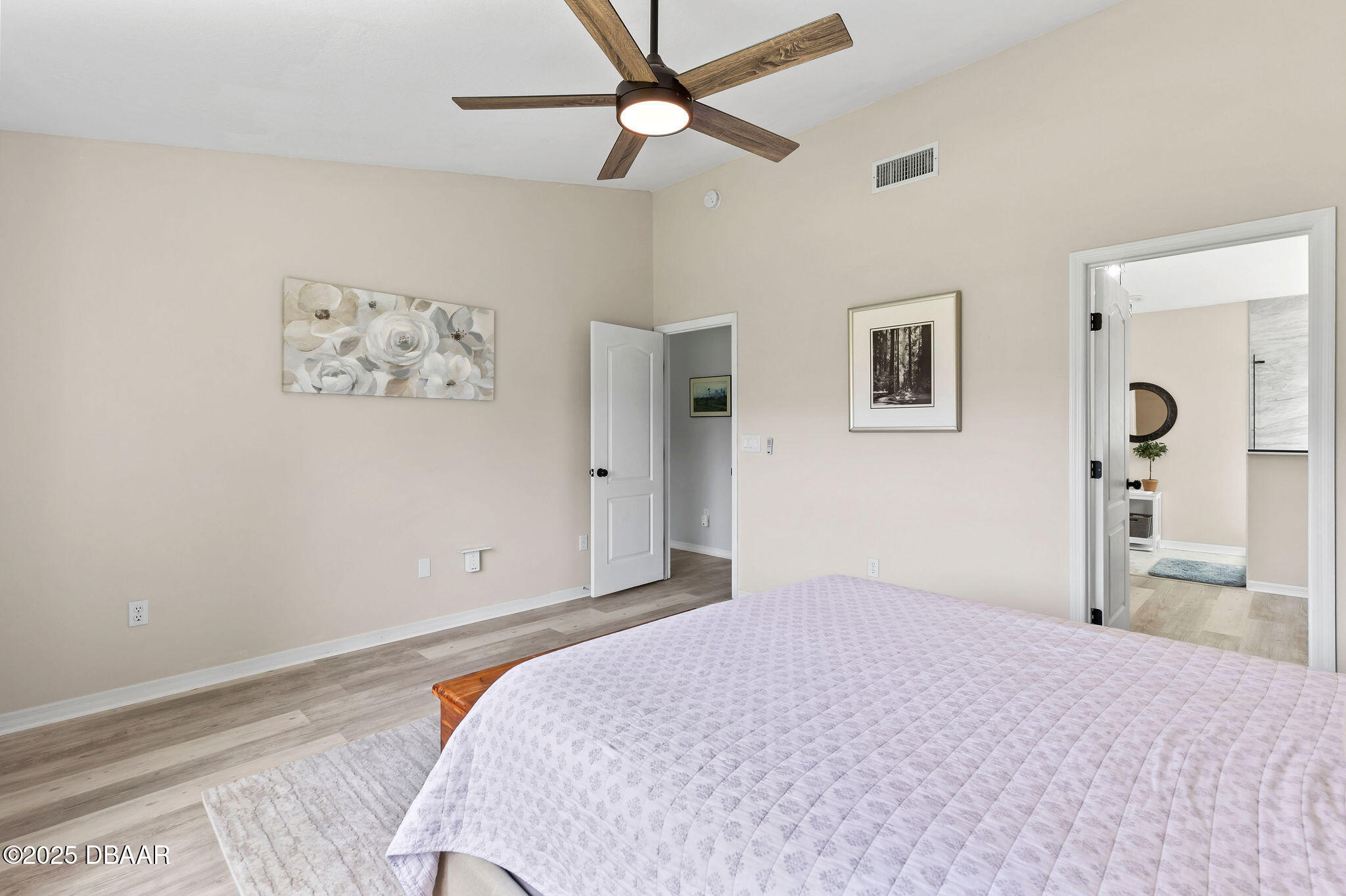 35 China Moon Drive Ormond Beach, FL 32174 - Photo 26 of 40 a bedroom with a bed and a painting on the wall