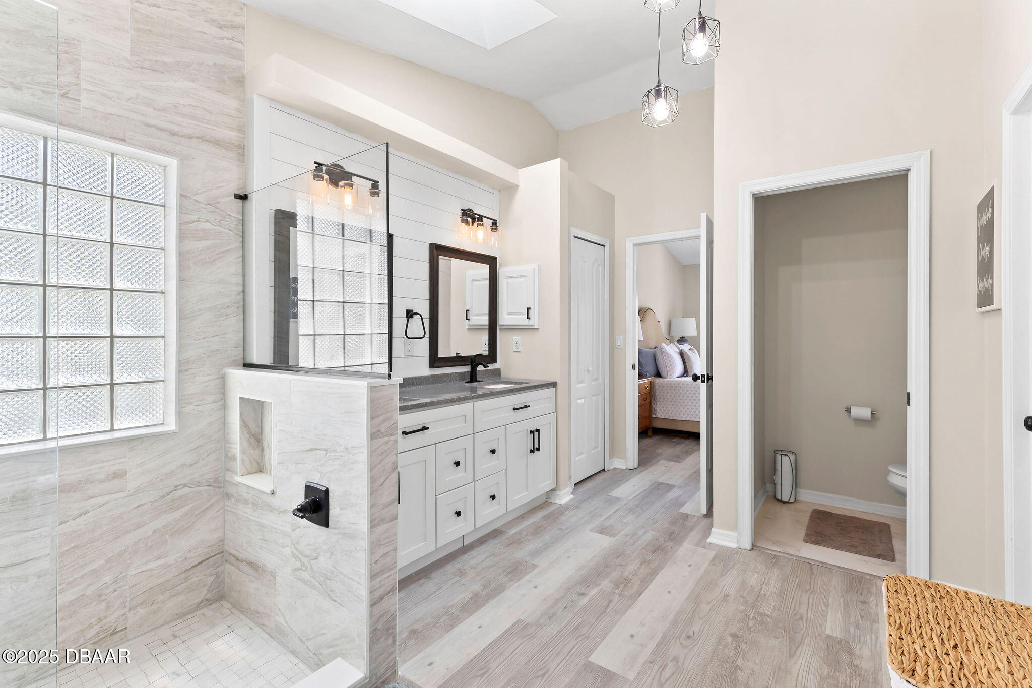35 China Moon Drive Ormond Beach, FL 32174 - Photo 28 of 40 a spacious bathroom with a double vanity sink a toilet a mirror and shower