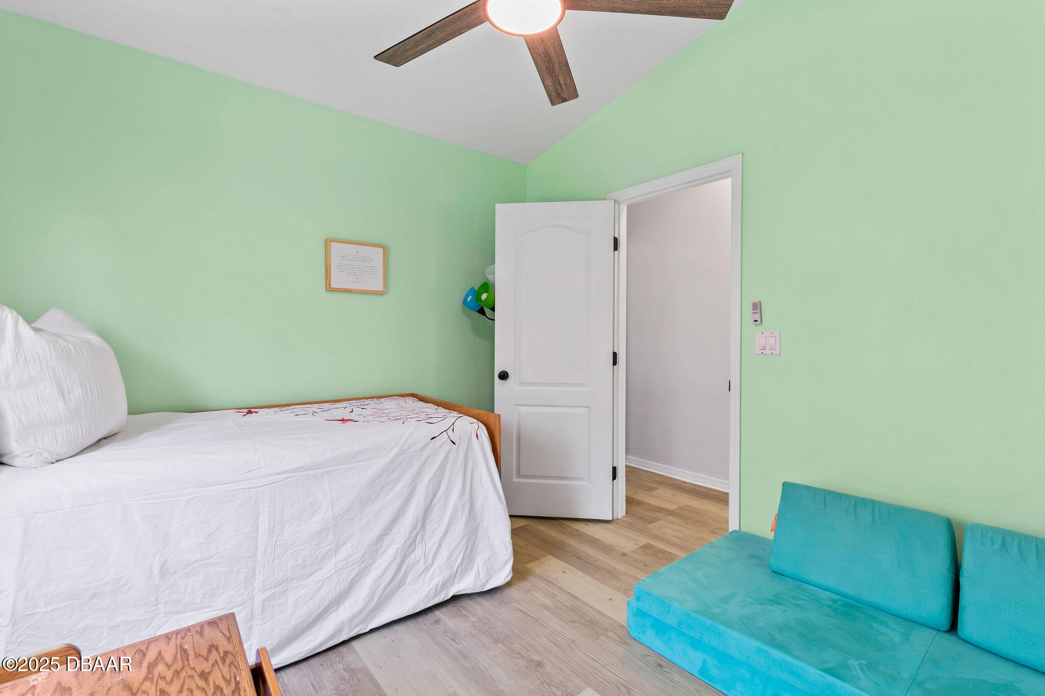 35 China Moon Drive Ormond Beach, FL 32174 - Photo 35 of 40 a bedroom with a bed and a ceiling fan