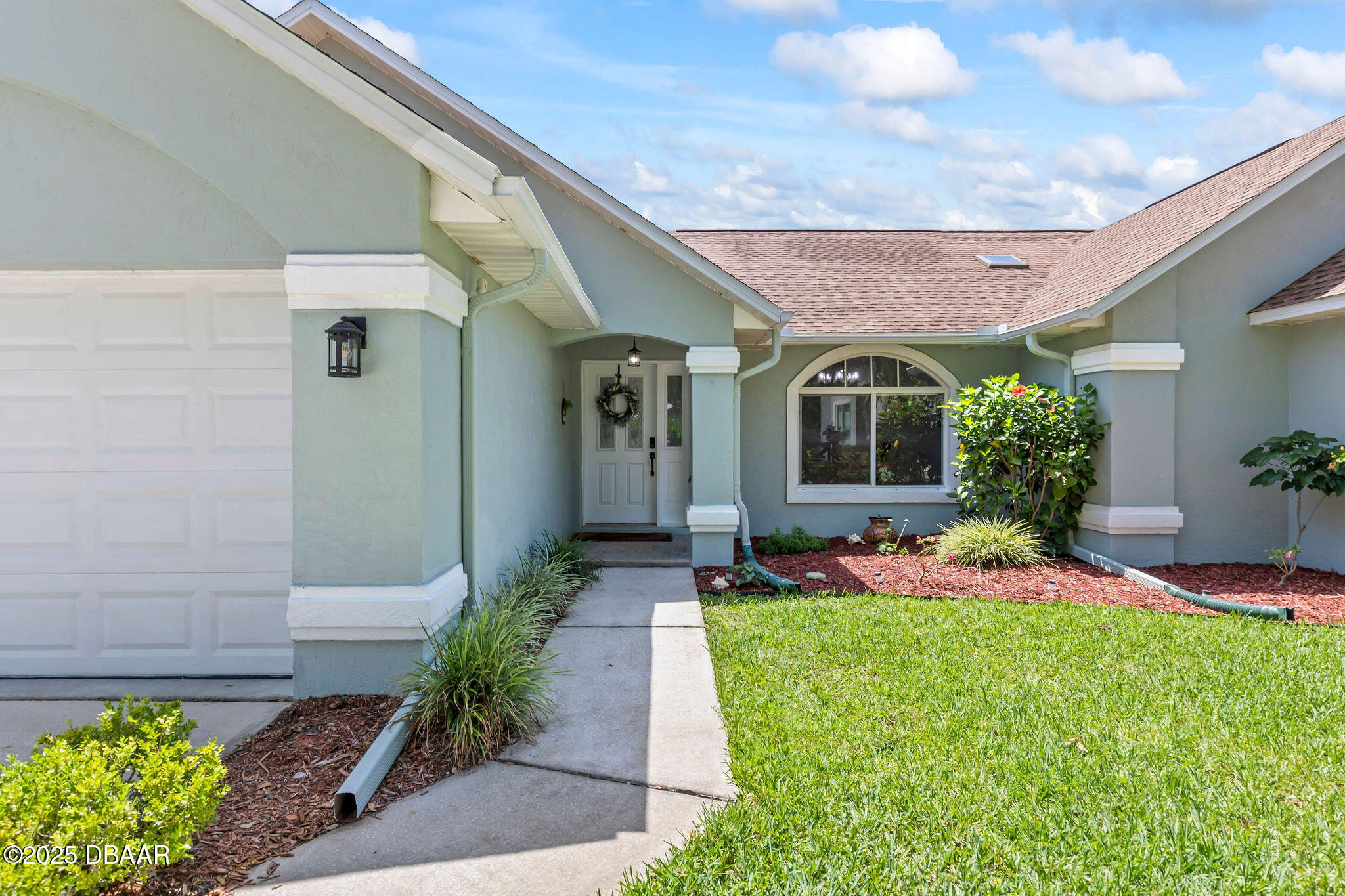 35 China Moon Drive Ormond Beach, FL 32174 - Photo 4 of 40 a front view of a house with a yard