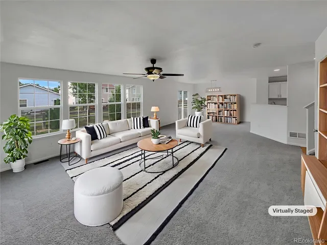 a living room with furniture and a table