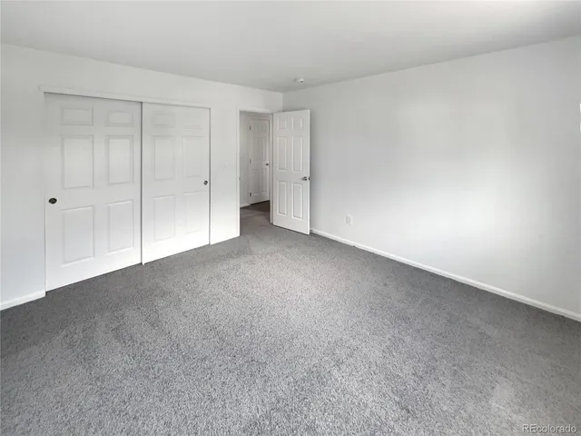 a view of an empty room and entryway