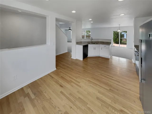 a view of kitchen with wooden floor