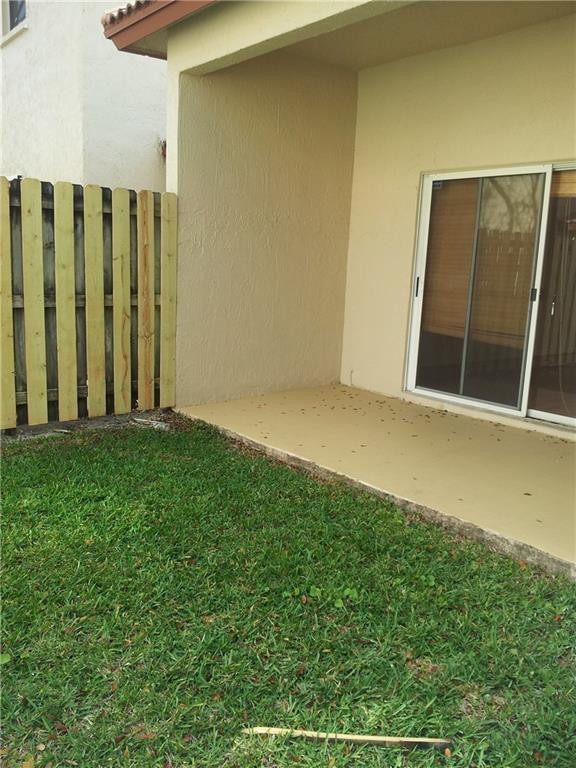 16150 Emerald Cove Road, Unit 16150 Weston, FL 33331 - Photo 12 of 17 a view of a backyard