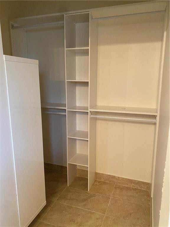 16150 Emerald Cove Road, Unit 16150 Weston, FL 33331 - Photo 7 of 17 a view of an empty room with empty racks