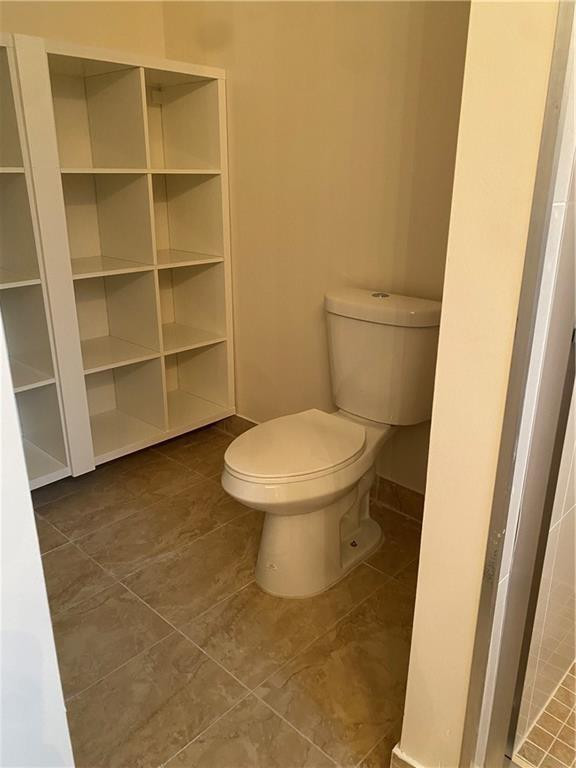 16150 Emerald Cove Road, Unit 16150 Weston, FL 33331 - Photo 8 of 17 a bathroom with a toilet and a sink