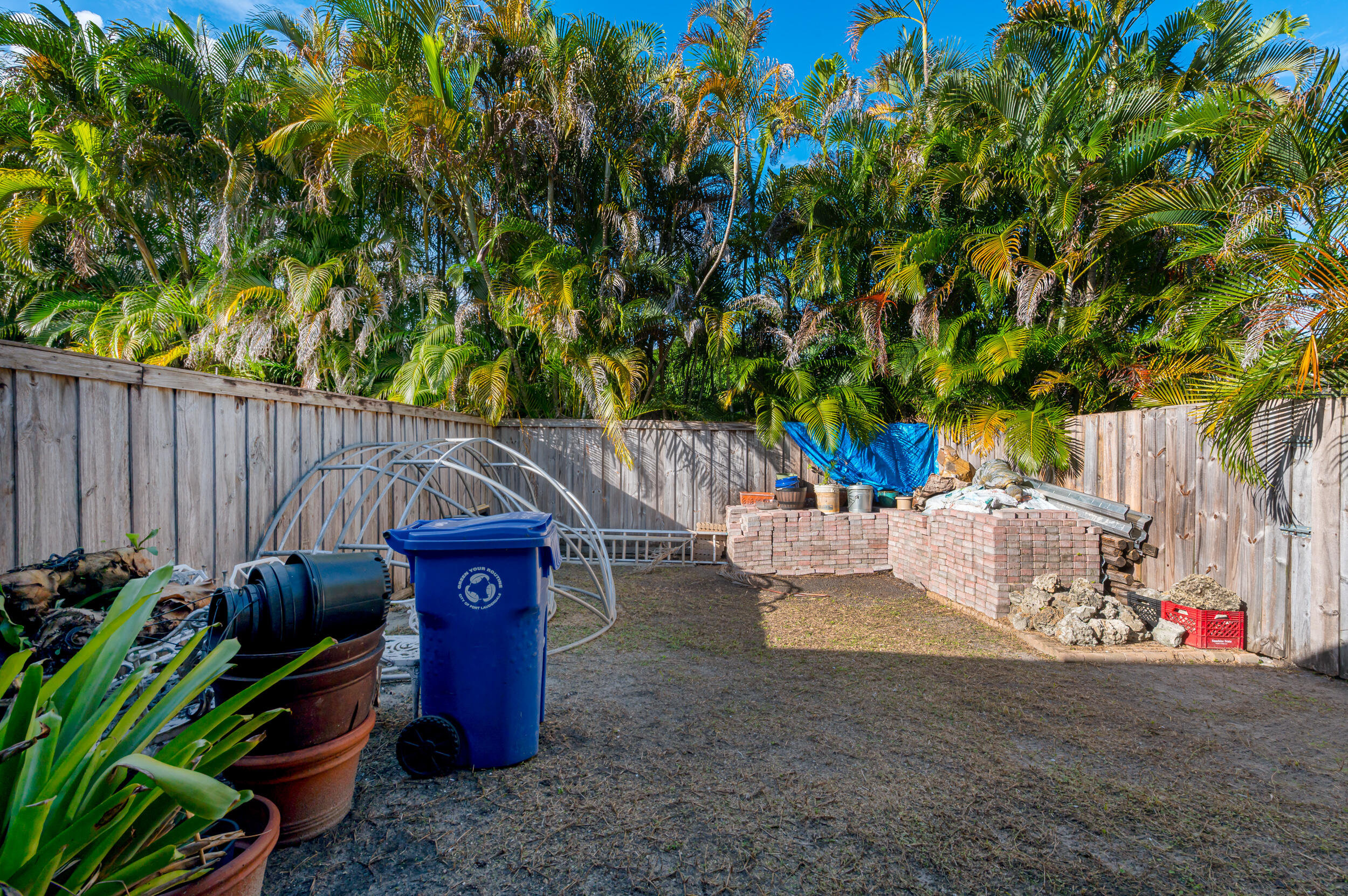 801 Southwest 12th Place Fort Lauderdale, FL 33315 - Photo 16 of 26 a backyard of a house with barbeque oven and outdoor seating