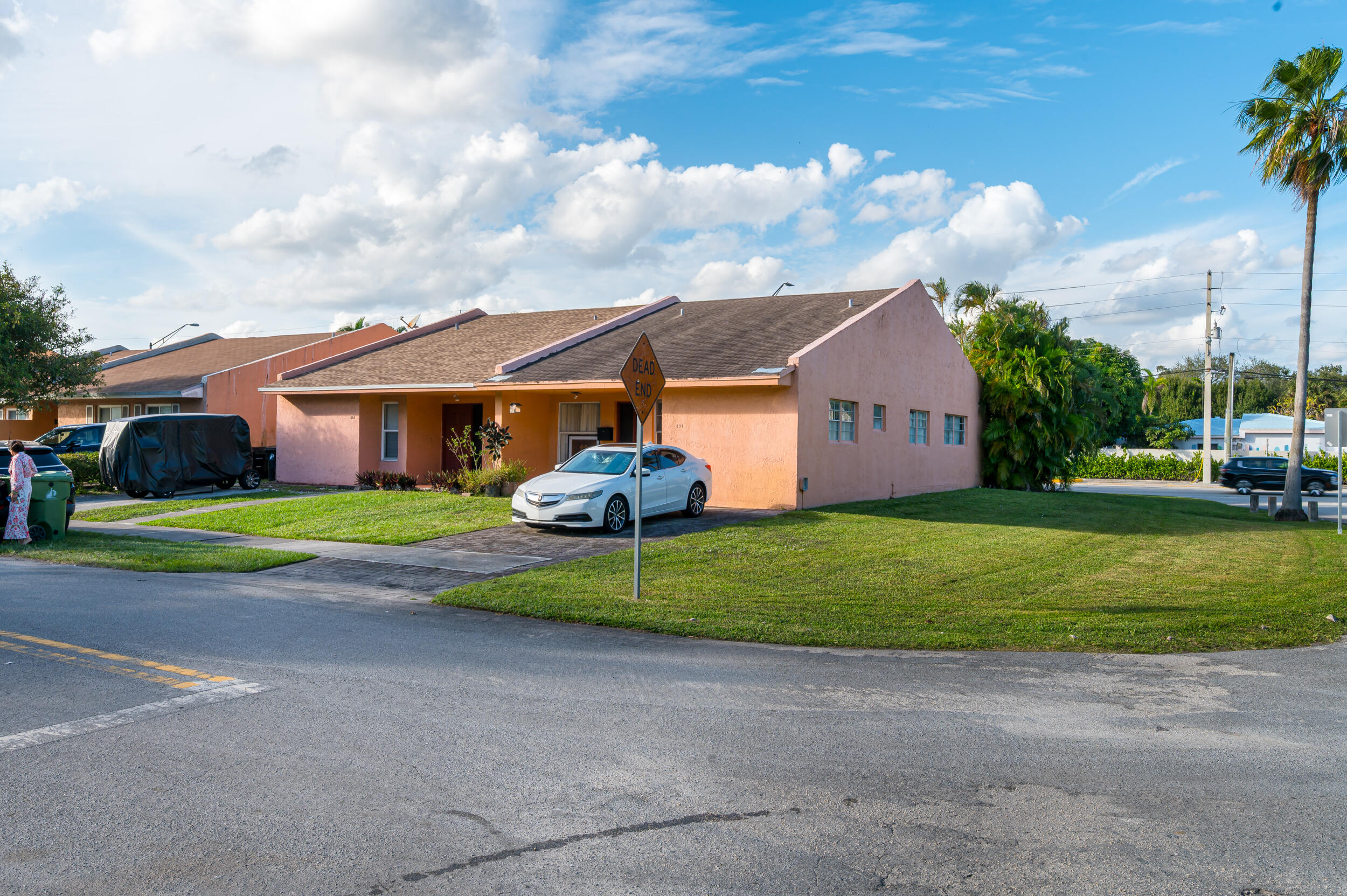 801 Southwest 12th Place Fort Lauderdale, FL 33315 - Photo 2 of 26 a front view of a house with a yard and garage