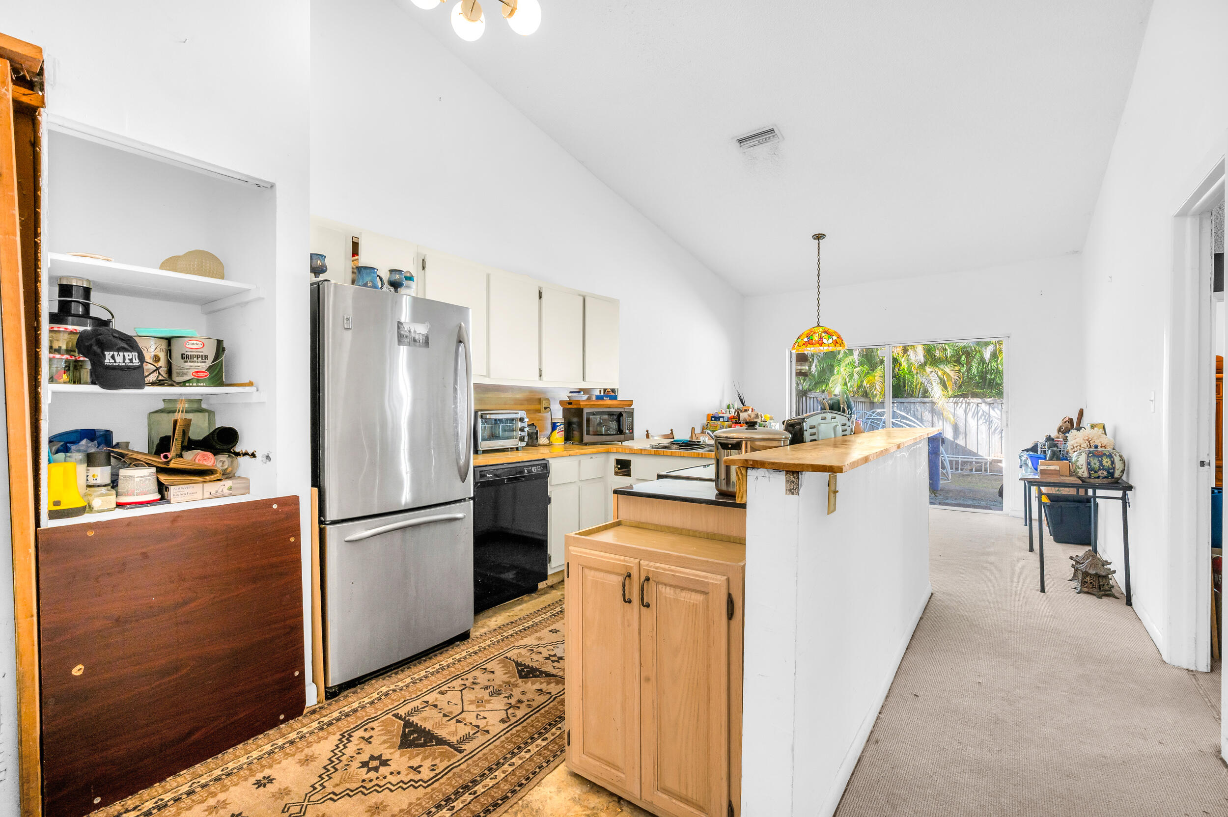 801 Southwest 12th Place Fort Lauderdale, FL 33315 - Photo 6 of 26 a kitchen that has a refrigerator a stove and a sink