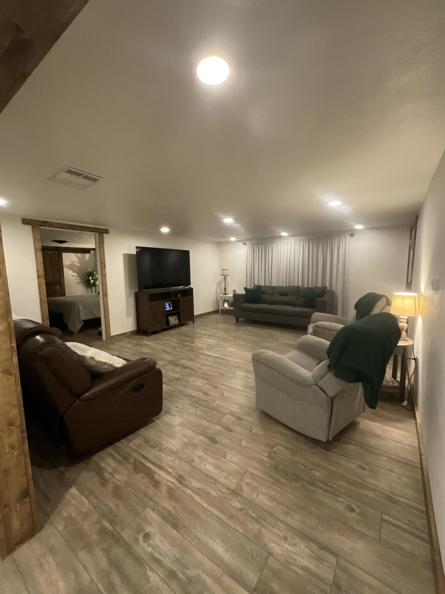 211 Reed Avenue Whitharral, TX 79336 - Photo 3 of 20 a living room with furniture and a couch