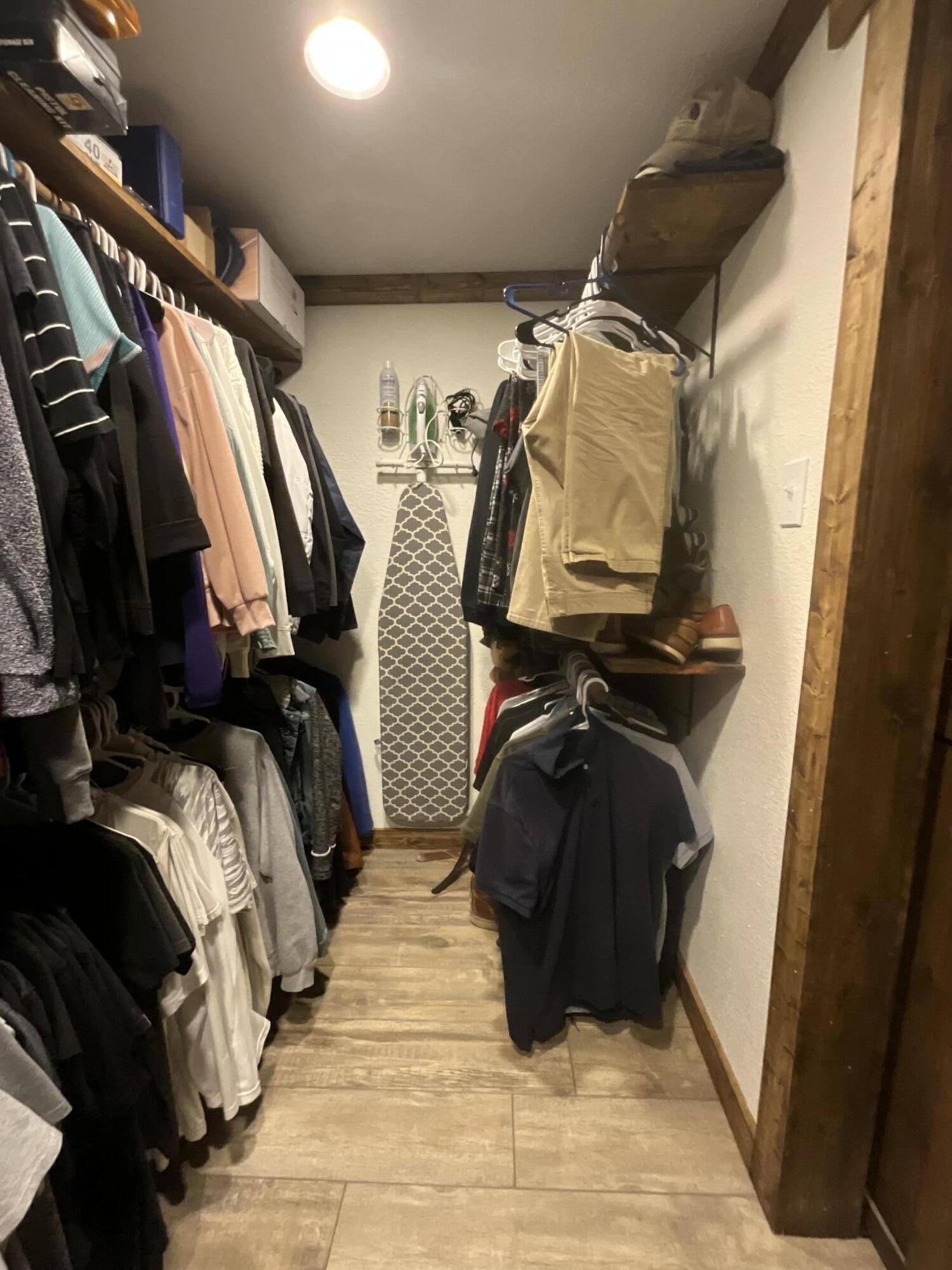 211 Reed Avenue Whitharral, TX 79336 - Photo 9 of 20 a view of walk in closet with clothes and shoes