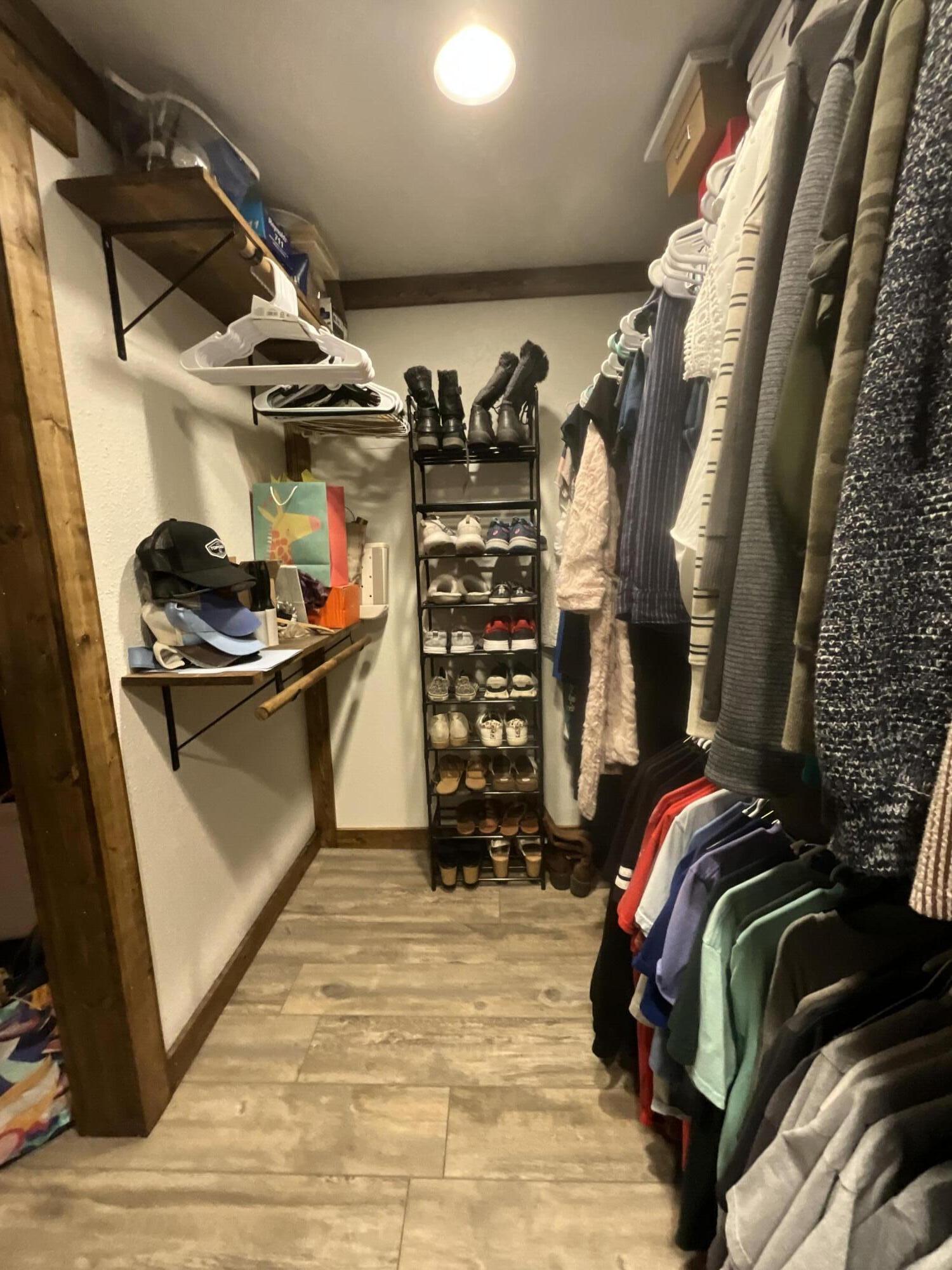 211 Reed Avenue Whitharral, TX 79336 - Photo 10 of 20 a view of walk in closet with clothes and shoes