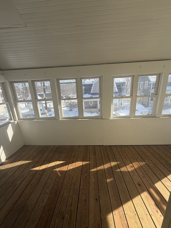 23 Saunders Street, Unit 25F North Andover, MA 01845 - Photo 12 of 12 an empty room with wooden floor and windows