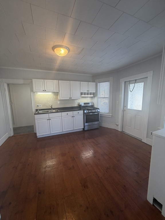 23 Saunders Street, Unit 25F North Andover, MA 01845 - Photo 2 of 12 a large kitchen with cabinets and wooden floor